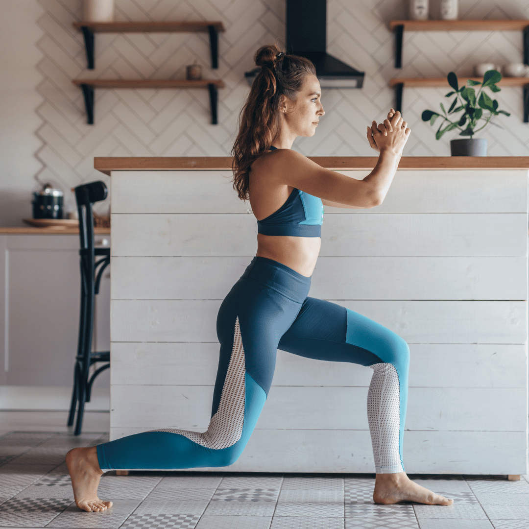 Woman performing a lunge exercise at home to strengthen leg muscles