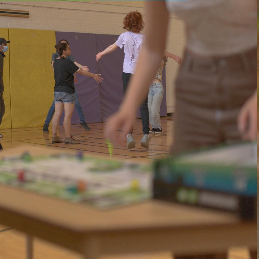 kids playing boardgains fitness game and working out in physical education class