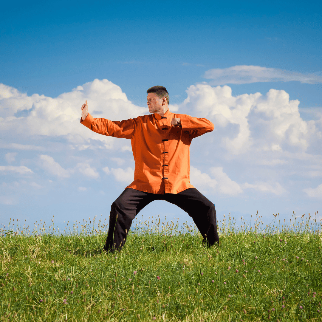 Male completing the bow and arrow exercise from the ancient practice of Qi gong