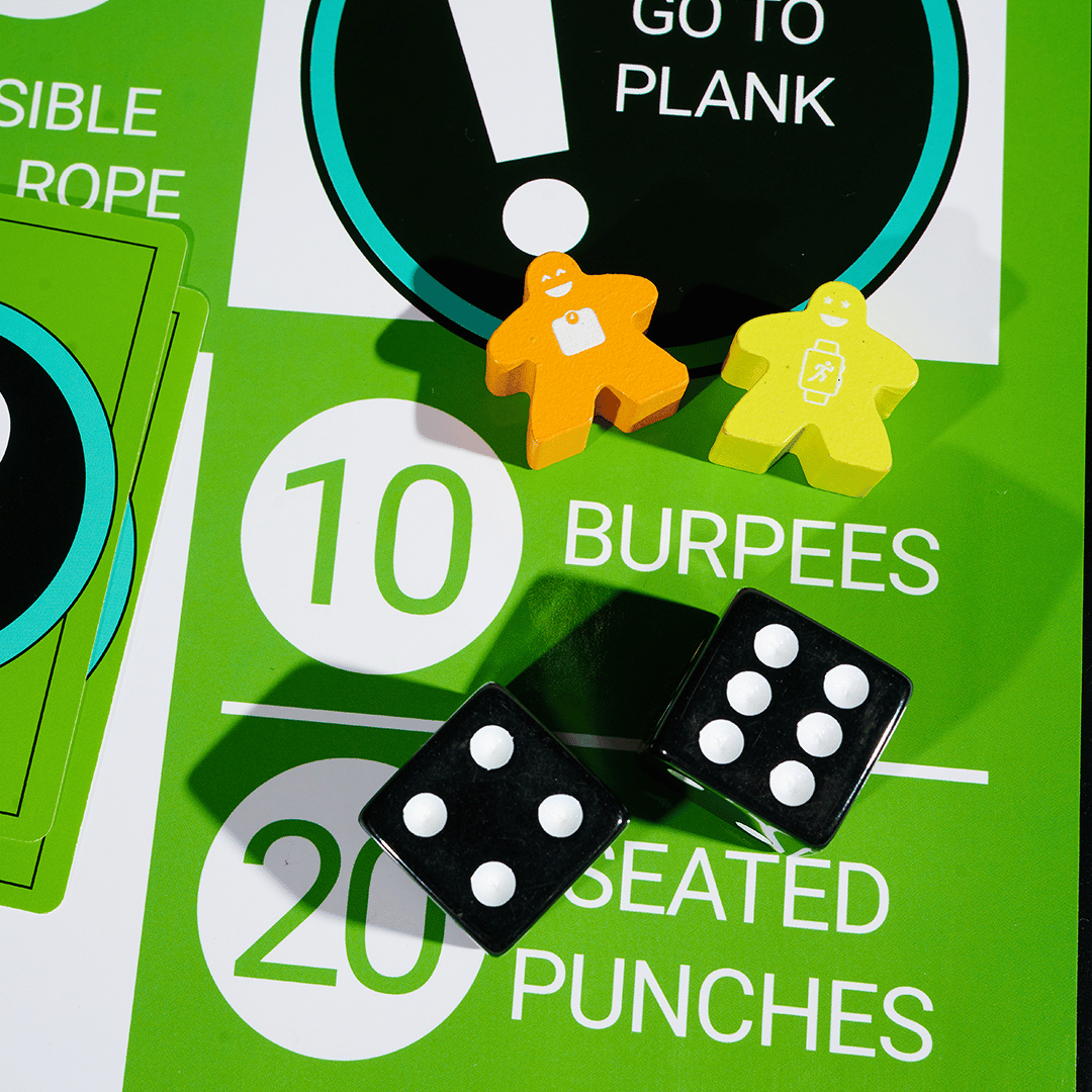 Boardgains Gym Games For bootcamp workouts using bodyweight exercises with 2 black dice and 2 different coloured meeples